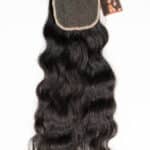 Natural black raw Indian wavy lace closure on a plain white background