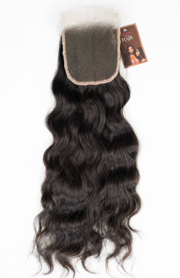 Natural black raw Indian wavy lace closure on a plain white background